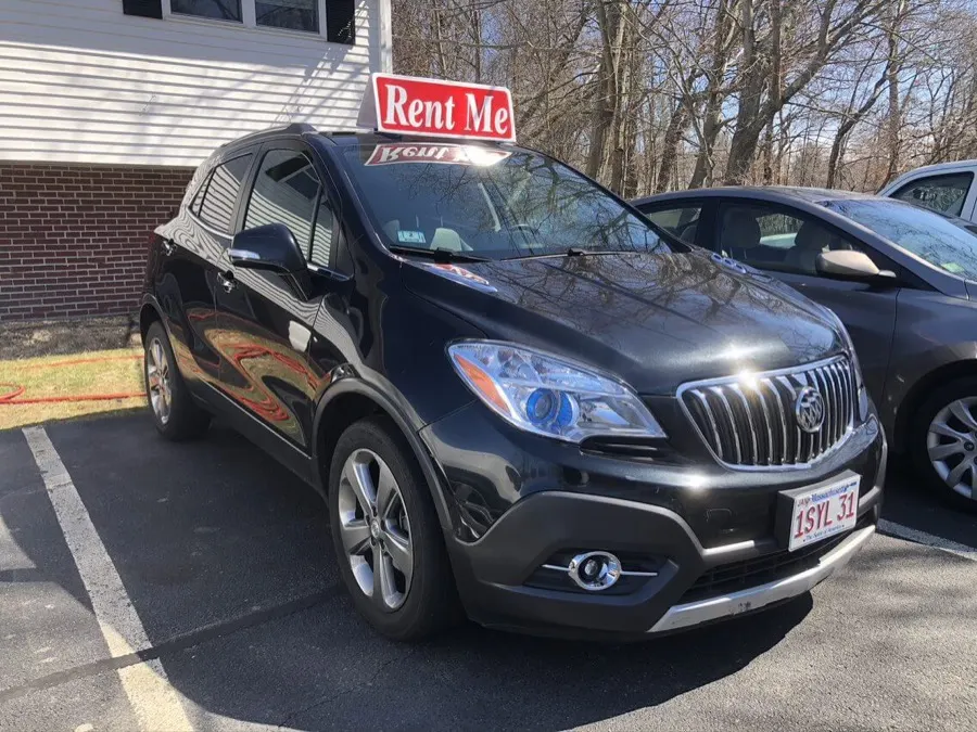 Black Buick SUV with a Rent Me sign in the WR Auto Body lot